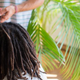 Dreadlock artist Ananda Rieber repairs and maintains a man’s dread hairstyle in his flat in Berlin July 9, 2013.
JOHANNES EISELE/AFP/Getty Images